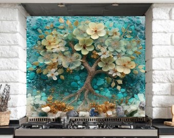 Può includere: Alzatina da cucina decorativa con un albero stilizzato con fiori color crema e rami marroni su sfondo turchese. Il design include piccole pietre blu e grigie, creando un tema ispirato alla natura.
