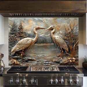 May include: A decorative kitchen backsplash featuring a 3D relief of two herons facing each other near a lake. The artwork has a neutral color palette with shades of beige, gray, and blue, and includes trees and mountains.