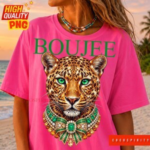 Create the ultimate statement pieces with this luxurious Boujee jeweled leopard sublimation design bundle! This glamorous set includes two stunning color variations—emerald green and sapphire blue—featuring a jaguar head completely encrusted in sparkling diamonds and intricate gold details. Perfectly capturing the trendy maximalist aesthetic, these high-quality PNGs