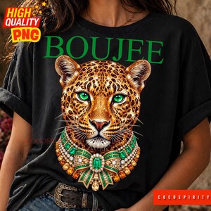 Create the ultimate statement pieces with this luxurious Boujee jeweled leopard sublimation design bundle! This glamorous set includes two stunning color variations—emerald green and sapphire blue—featuring a jaguar head completely encrusted in sparkling diamonds and intricate gold details. Perfectly capturing the trendy maximalist aesthetic, these high-quality PNGs