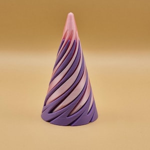 May include: A purple and pink cone-shaped ornament with a swirling pattern. The ornament is made of a smooth, glossy material.