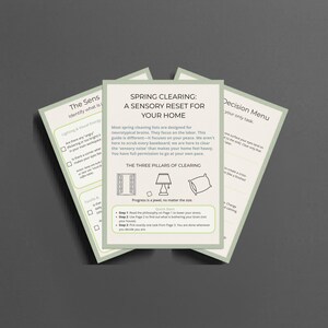 May include: Three cards with a light green border, stacked on top of each other. The central card has the title "SPRING CLEARING: A SENSORY RESET FOR YOUR HOME." The cards contain text and illustrations.