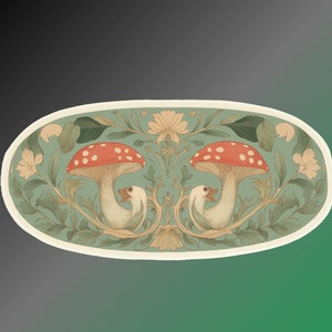 May include: A circular design featuring two red and white mushrooms with white birds perched on top. The mushrooms are surrounded by green leaves and white flowers.