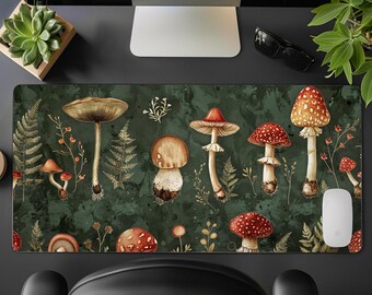 May include: A green and brown mousepad with a watercolor design of mushrooms. The mushrooms are red, white, and brown with white spots. The background is a dark green with brown and white accents.