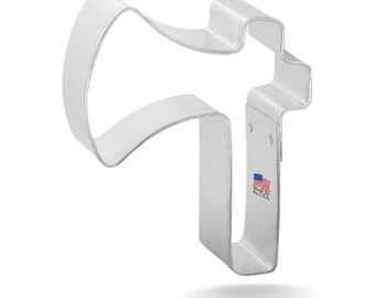 May include: A silver metal cookie cutter shaped like a megaphone. The cookie cutter is made in the USA.