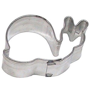 May include: A shiny, silver-colored metal snail-shaped cookie cutter. The cutter has a curved body and a detailed head with antennae. The edges are smooth and the overall design is simple and clean.