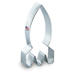 May include: A silver metal rocket-shaped cookie cutter. The cutter is made in the USA.