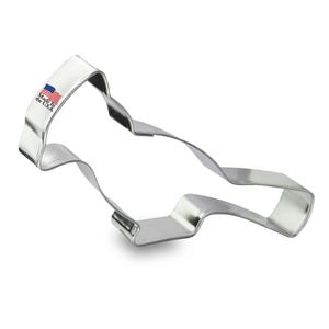 May include: A silver metal cookie cutter shaped like a race car. The cookie cutter has a "Made in the U.S.A." label on the side.