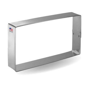 May include: A silver rectangular cake pan with a smooth, shiny finish. Made in the USA.