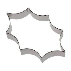 May include: A silver metal cookie cutter shaped like a starburst with eight points.