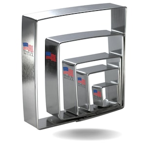 May include: Set of five stainless steel square cookie cutters, nested together. The cutters are made in the USA and feature a small American flag on each.