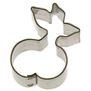 May include: A silver metal cookie cutter shaped like a cherry with a stem and leaf.