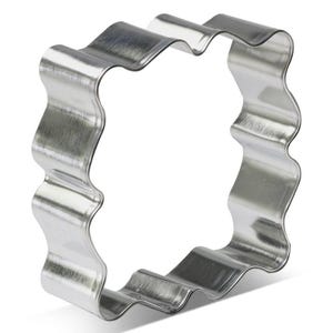 May include: A shiny, silver-colored cookie cutter in a square shape with wavy edges. The metal cutter is designed for baking and crafting. The wavy design adds a decorative touch to cookies, fondant, or other treats.