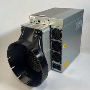 May include: A silver and black mining rig with three fans and a black exhaust hose. The rig has a power cord and a network cable connected to it.