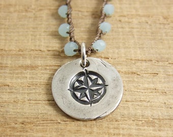 Crocheted Necklace with Brown Cord, Tiny Blue Crystal Beads and a Pendant with a Compass Design SN-254