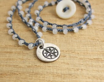 Crocheted Necklace with an Indigo Blue Cord, Tiny White Crystal Beads and a Pendant with a Compass Design SN-346
