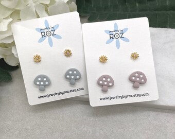 Two pack of Stud Earrings made with Blue or Pink Polymer Clay Shaped into Mushrooms with White Dots and Gold Plated Flowers PCE-635