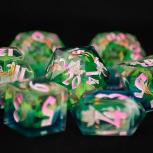 May include: A white ceramic mug with a black handle and the text "But First, Coffee" in a handwritten style. The mug is on a white surface. The mug is approximately 4 inches tall.