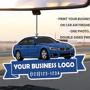 May include: A blue car-shaped air freshener hanging from a rearview mirror. The air freshener has a blue banner with the text "YOUR BUSINESS LOGO" and a phone number. The image also includes the text: "PRINT YOUR BUSINESS LOGO ON CAR AIR FRESHENERS! ONE PHOTO, DOUBLE-SIDED PRINTING!"