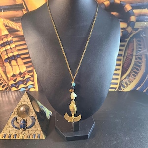 Antique Gold pewter charm  Ancient Egyptian Goddess Maat with scarab charm necklace attached to stainless steel chain.