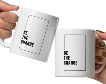 White and Black "Be the Change" Mug