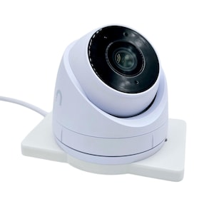May include: A white dome security camera with a black lens mounted on a white base.