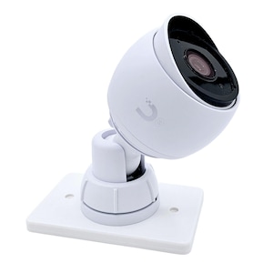 May include: White security camera with a black lens mounted on a white wall mount. The camera has a white dome shape and a black lens with a small, round, dark gray camera lens. The camera is mounted on a white wall mount with a white base and a white arm that allows the camera to be adjusted.