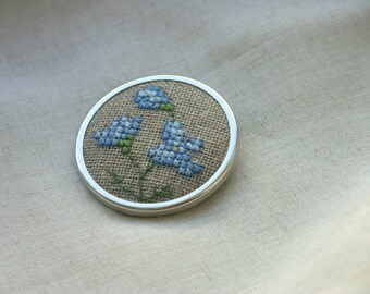 floral emboidered brooch pin  with linen flower on linen fabric