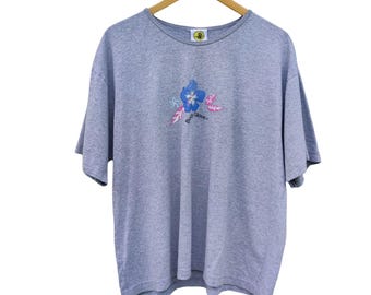 Camiseta Body Glove Hibiscus vintage de los 90, una joya: un clásico retro de la moda surfera.