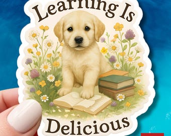 Aprender es delicioso: calcomanía de vinilo divertida de un cachorro labrador amarillo masticando un libro