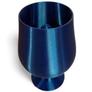 May include: A deep blue, metallic-finish goblet with a smooth, curved exterior and a wide, open top. The vessel features a central, pointed conical protrusion rising from the interior base, creating a distinct silhouette for this drinking cup.