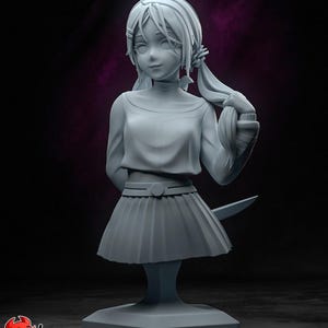 May include: A light gray monochrome bust figurine of a character with shoulder-length hair tied in a side ponytail. The figure wears a long-sleeved top, a pleated skirt with a belt, and holds a small blade behind their back. The base is hexagonal.