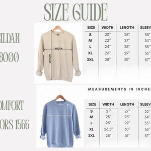May include: Size guide for Gildan 18000 and Comfort Colors 1566 sweatshirts. Measurements in inches are provided for width, length, and sleeve length for sizes S, M, L, XL, and 2XL. A beige and a blue sweatshirt are shown.