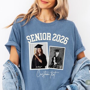 May include: Blue jean-colored t-shirt with the text "SENIOR 2026" in white block letters. Two framed black and white photos are below the text. The shirt also has the words "now" and "Custom text" in script.