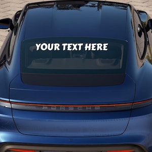 May include: A blue car with a rear window decal that says "YOUR TEXT HERE".