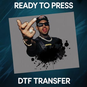May include: Image with the text "READY TO PRESS" at the top and "DTF TRANSFER" at the bottom. The image features a person wearing a black cap, sunglasses, and a black shirt. The person is making a hand gesture with their middle finger extended.