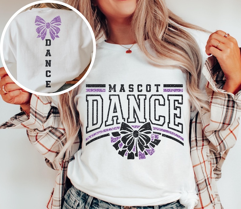 May include: White t-shirt with a purple glitter bow and the text "MASCOT DANCE" in black with a purple glitter outline. The back of the shirt has a purple glitter bow and the word "DANCE" vertically down the back.