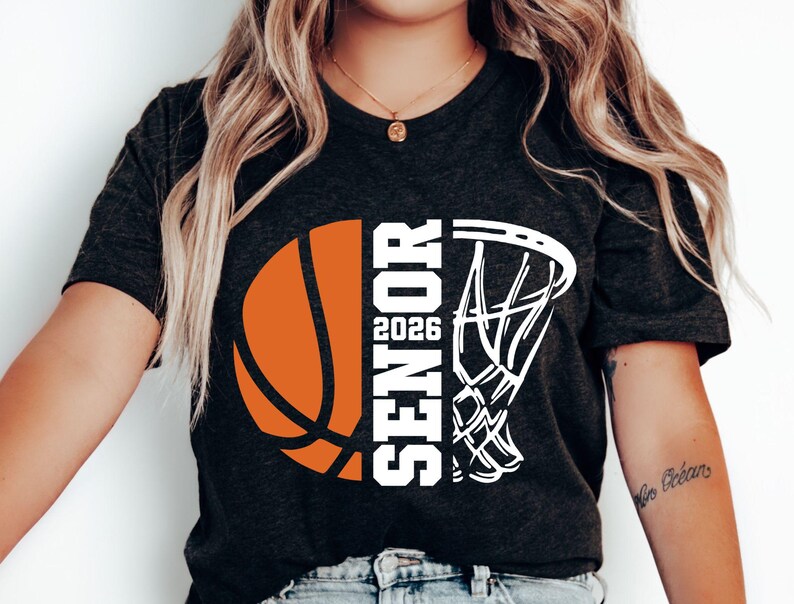 May include: Black t-shirt with a white basketball and basketball hoop graphic. The text "Senior 2026" is printed on the shirt.