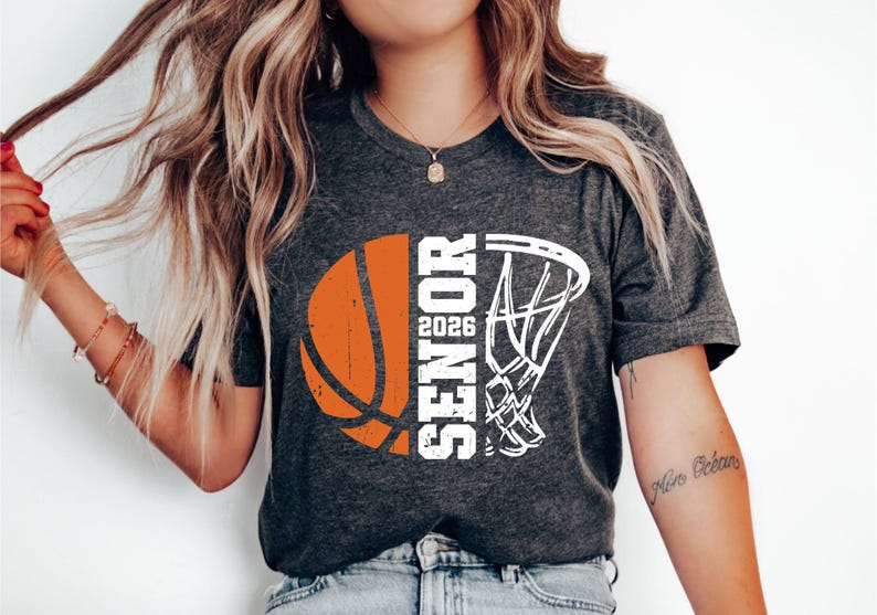 May include: A gray t-shirt with a white basketball and basketball hoop graphic. The graphic says "Senior 2026".