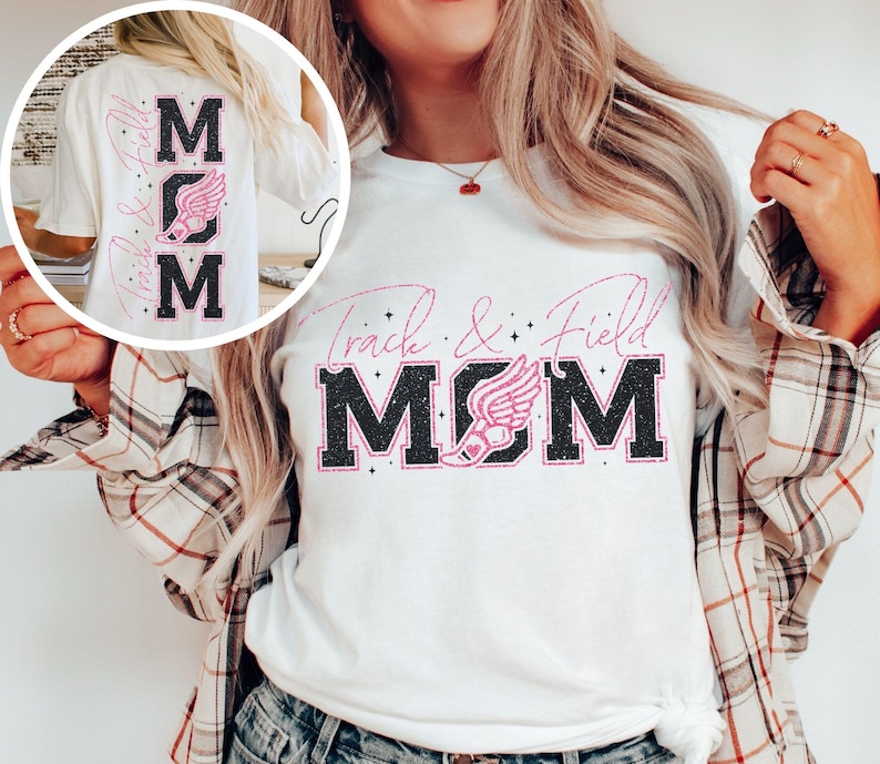 May include: White t-shirt with black text that says "Track & Field MOM" with a pink running shoe graphic. The shirt has a glittery effect.