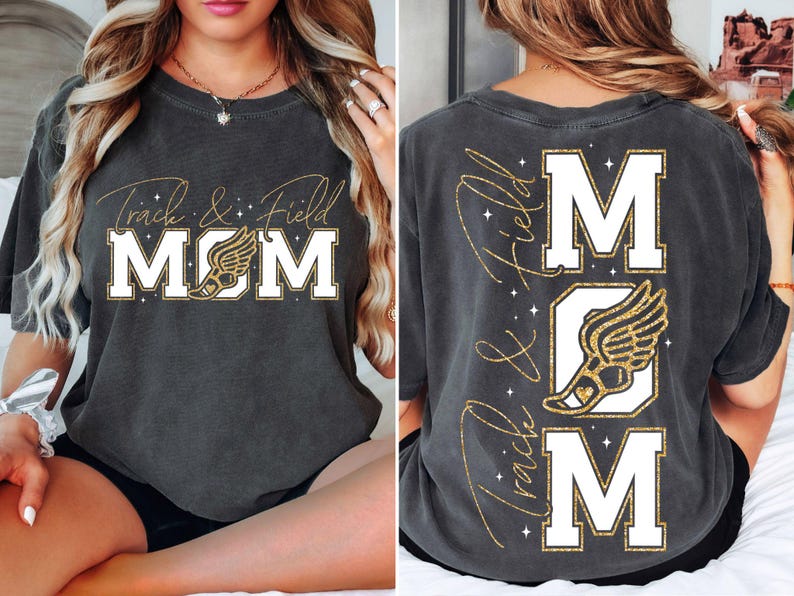 May include: A dark gray t-shirt with gold glitter lettering that reads "Track & Field MOM" with a gold glitter running shoe graphic. The back of the shirt has the same design but vertically with the text reading "Track & Field MOM"