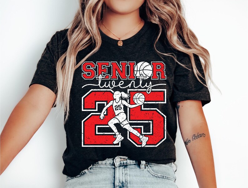 May include: Black t-shirt with red and white text that says "Senior twenty five" with a basketball player graphic.