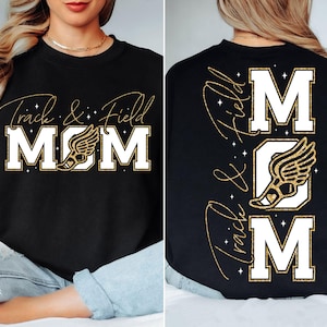 May include: Black t-shirt with gold glitter text that reads "Track & Field MOM" with a gold glitter running shoe graphic. The back of the shirt has the text "Track & Field" written vertically with a gold glitter running shoe graphic and the word "MOM" written vertically.