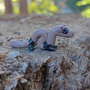 Brown and black ferret figurine.