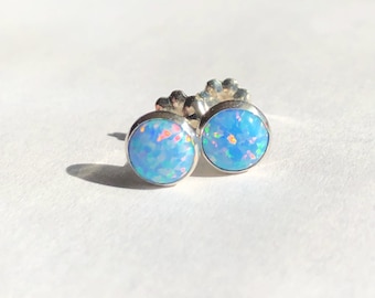 Opal stud earrings set in sterling silver. Adorable 6mm opal studs. Opal and sterling silver stud earrings. Cornflower blue opal studs