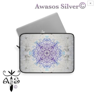 May include: A white laptop sleeve with a blue and purple mandala design on a white woodgrain background. The sleeve is closed and a laptop is inside.