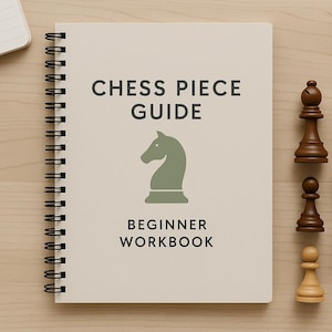 May include: A spiral-bound notebook titled "Chess Piece Guide Beginner Workbook" with a green knight graphic. Chess pieces, including a bishop, queen, pawn, and rook, are arranged on a light wood surface.