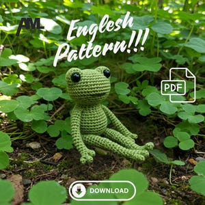 May include: A green crocheted frog sits among green foliage. The frog has black eyes and is made with a textured stitch. The image includes the text "English Pattern!!!" and a PDF download icon.