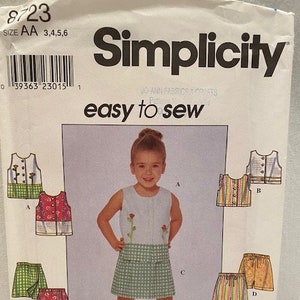 May include: Simplicity sewing pattern number 8723 for girls' clothing. The pattern includes instructions for a sleeveless top, a skirt, and shorts. The pattern is easy to sew and is available in sizes 3, 4, 5, and 6.