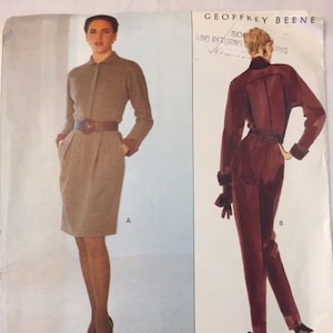 May include: Vogue Patterns American Designer sewing pattern featuring two Geoffrey Beene designs. One is a long-sleeved dress with a belt, and the other is a jumpsuit. The pattern number is 2597, and the size is 14-16-18.